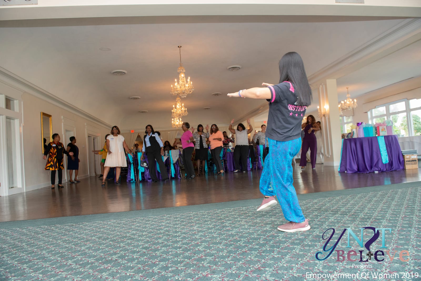 An instructor leading a group activity in the event ballroom