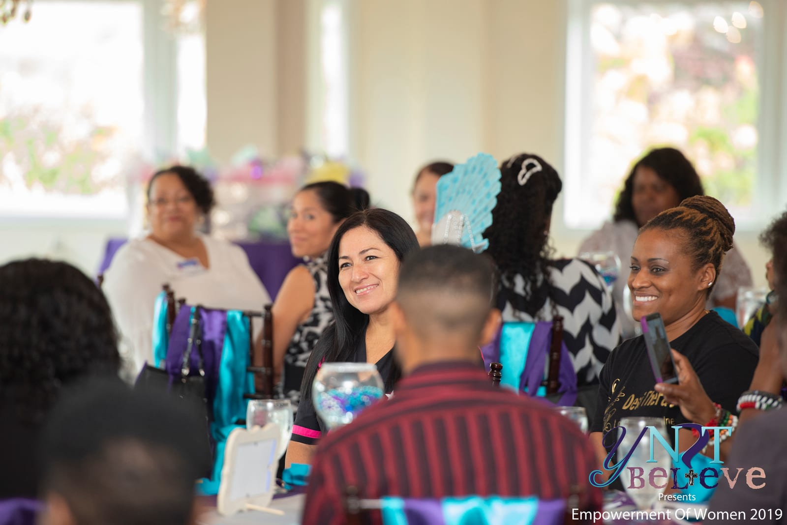 Community members gathered together during a Y Not Believe empowerment event